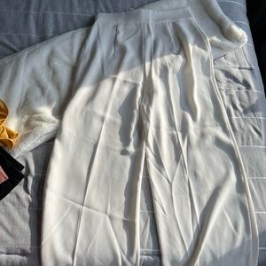 High-waisted pants with side zipper.